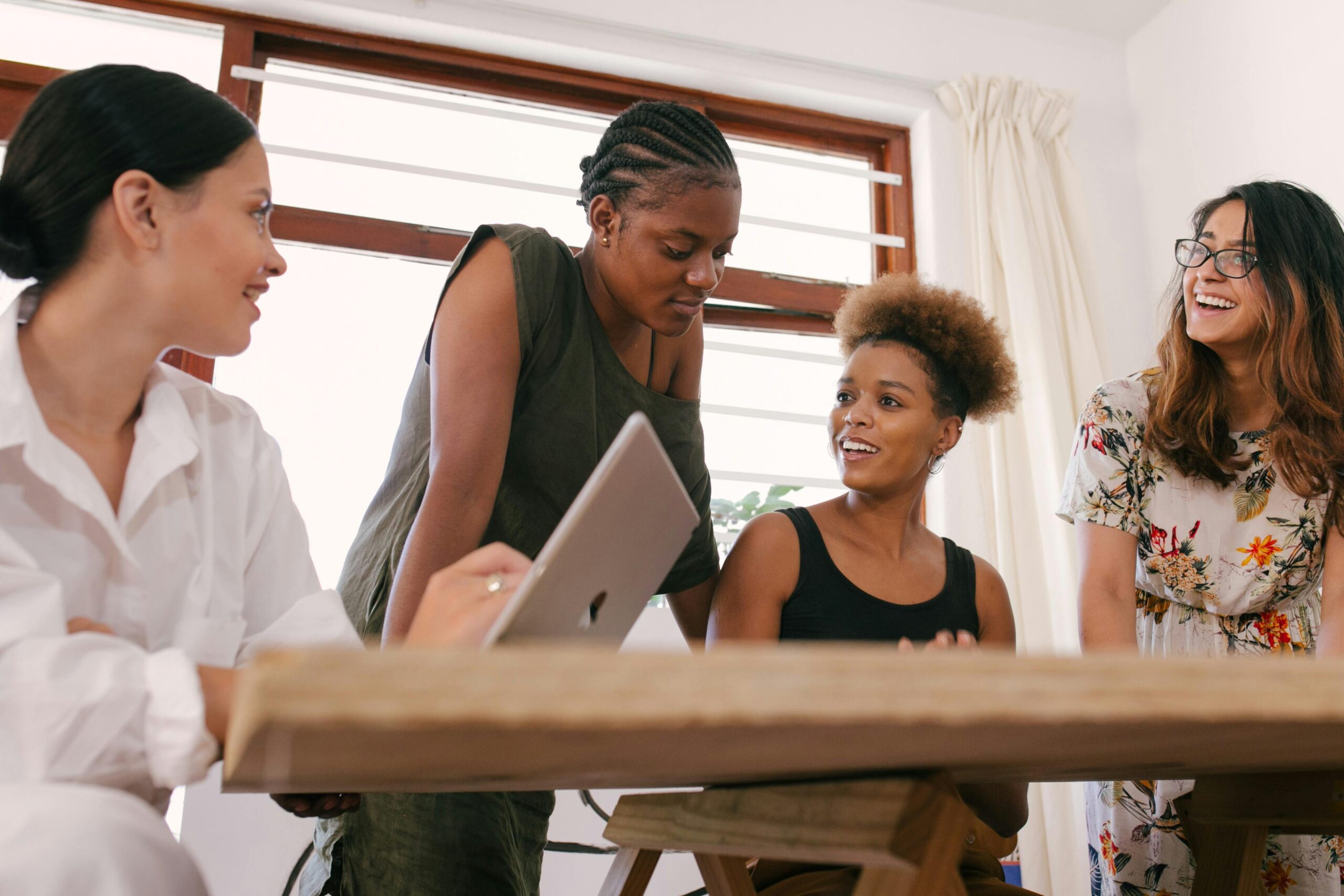Female leader presenting business strategy to her team
